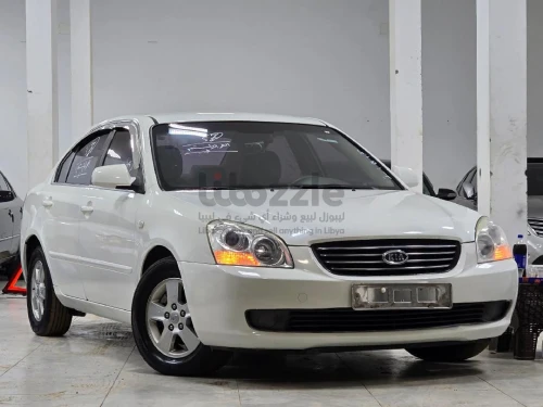 كيا لوتزي 2007 لون ابيض صالون بيج